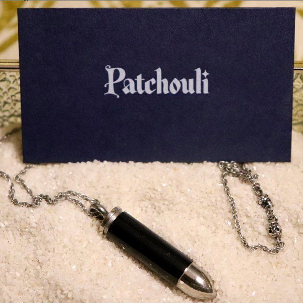 Black & Silver Steel Bullet Shaped Pendant Necklace w/ Patchouli Essential Oil